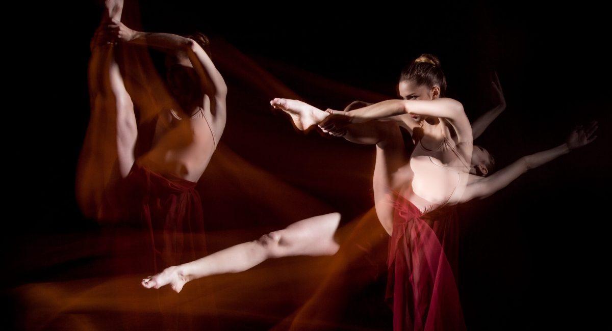 The sensual and emotional dance of beautiful ballerina. Photography technique with strobe